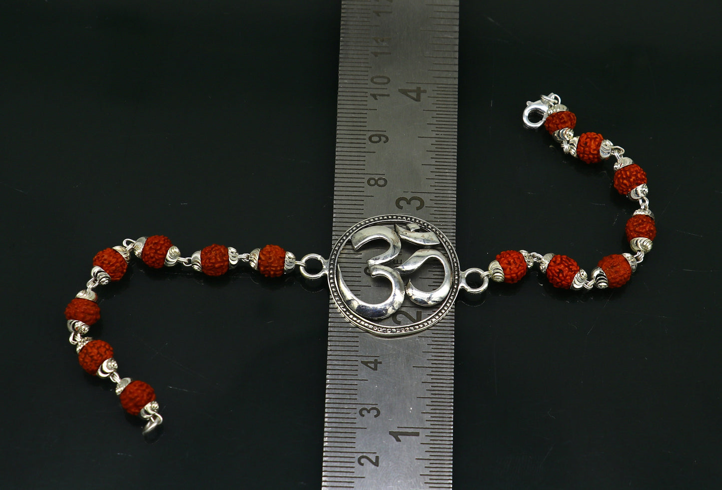 925 Sterling silver customized OM Rudraksha bead bracelet with Aum design, handcrafted by TRIBAL ORNAMENTS.