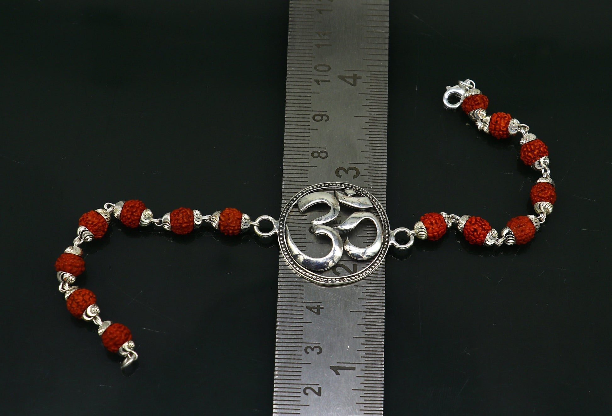 925 Sterling silver customized OM Rudraksha bead bracelet with Aum design, handcrafted by TRIBAL ORNAMENTS.