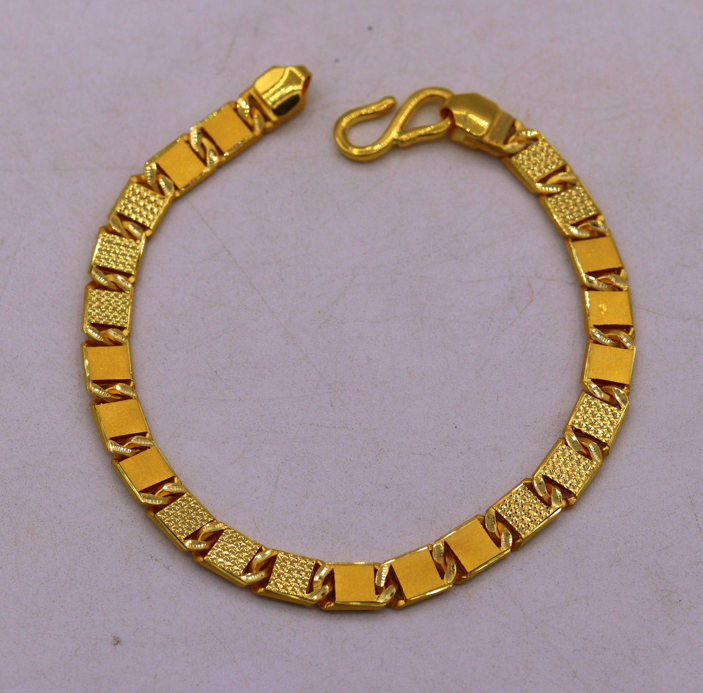 Handmade 22K yellow gold Royal Nawabi chain bracelet with diamond-cut design, men's luxury jewelry from TRIBAL ORNAMENTS.