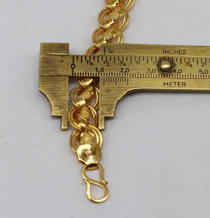 Handmade 22kt yellow gold Lotus design bracelet by TRIBAL ORNAMENTS, featuring intricate craftsmanship for men's wedding jewelry.
