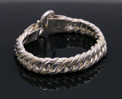 Vintage 7-inch 925 sterling silver Cuban link chain bracelet, unisex, solid jewelry with intricate detailing from Tribal Ornaments.