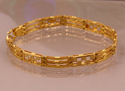 Authentic 22KT yellow gold handmade unisex flexible bracelet with solid design, hallmarked 916 Rajasthan India jewelry by TRIBAL ORNAMENTS.