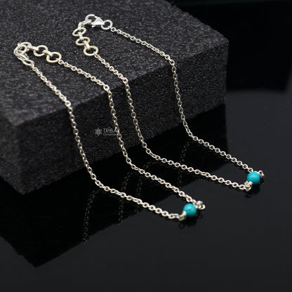 Sterling silver anklet bracelet with a single turquoise stone, lightweight and delicate, from TRIBAL ORNAMENTS.