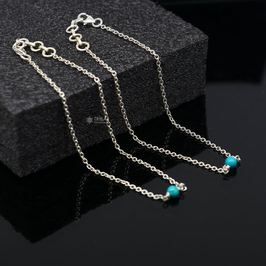 Sterling silver anklet bracelet with a single turquoise stone, lightweight and delicate, from TRIBAL ORNAMENTS.