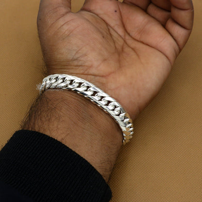 Sterling silver handmade men's bracelet with customized unique design, oxidized finish, heavy style, and royal jewelry detailing.