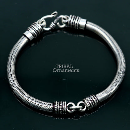 Sterling silver handmade snake chain bracelet by Tribal Ornaments, 5mm thick, flexible unisex jewelry with elegant design.