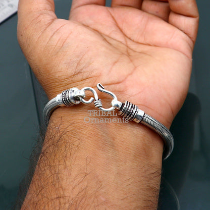 Handmade 5mm solid sterling silver snake chain unisex bracelet with flexible design and elegant craftsmanship.