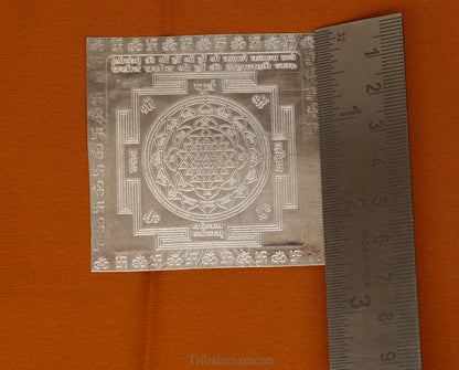 Pure silver Shri Laxmi Yantram for home temple puja, featuring intricate MahaLaxmi design from Tribal Ornaments.