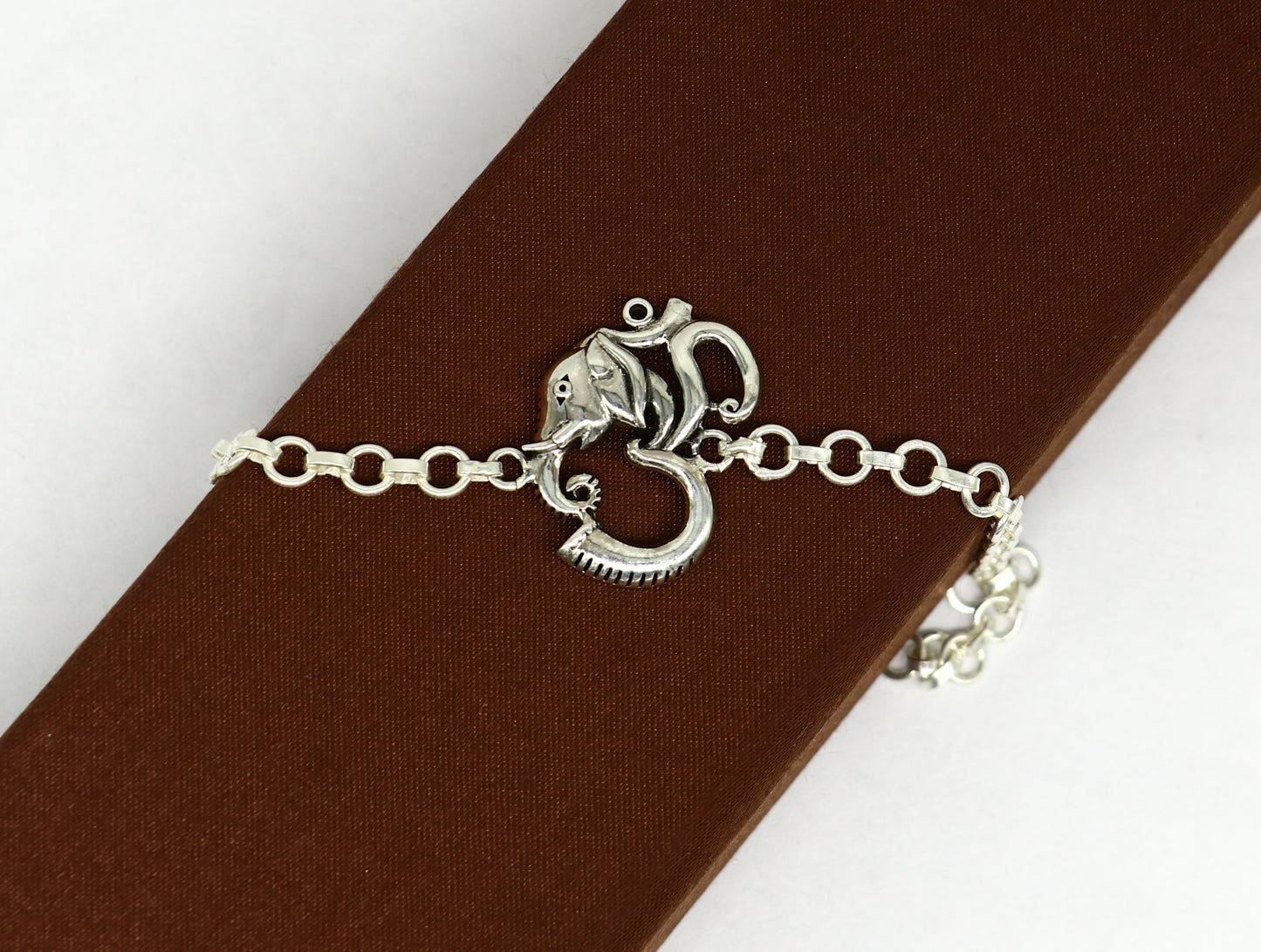 925 sterling silver Ganesha design bracelet by TRIBAL ORNAMENTS, 7-inch handmade bracelet with OM and AUM motifs.