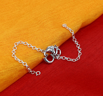 Sterling silver OM Ganesha design bracelet by TRIBAL ORNAMENTS, 7-inch handmade bracelet featuring intricate Aum and Ganesha motifs.
