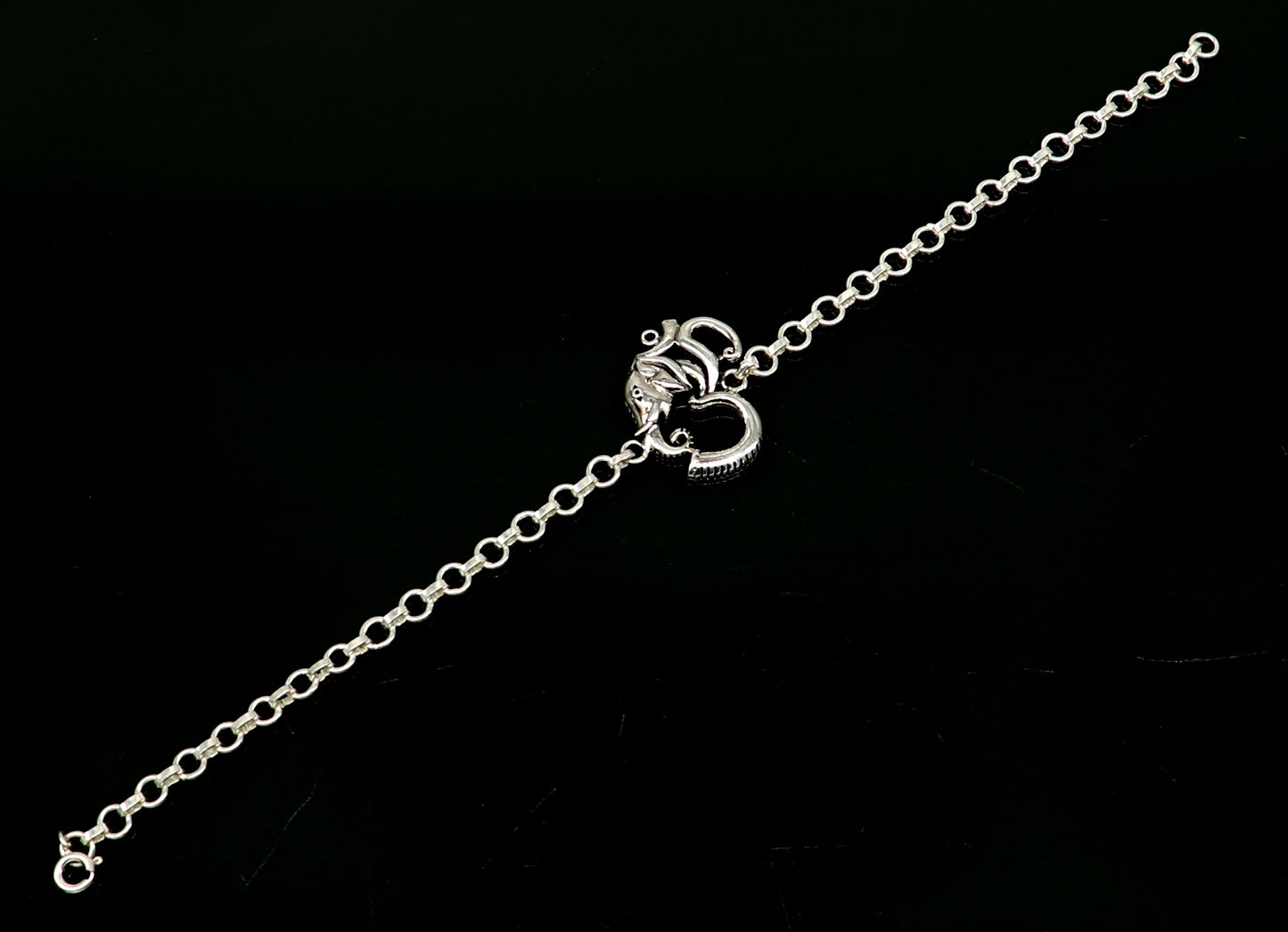 925 sterling silver OM Ganesha design bracelet by TRIBAL ORNAMENTS, handmade with intricate Aum and Ganesha motifs.