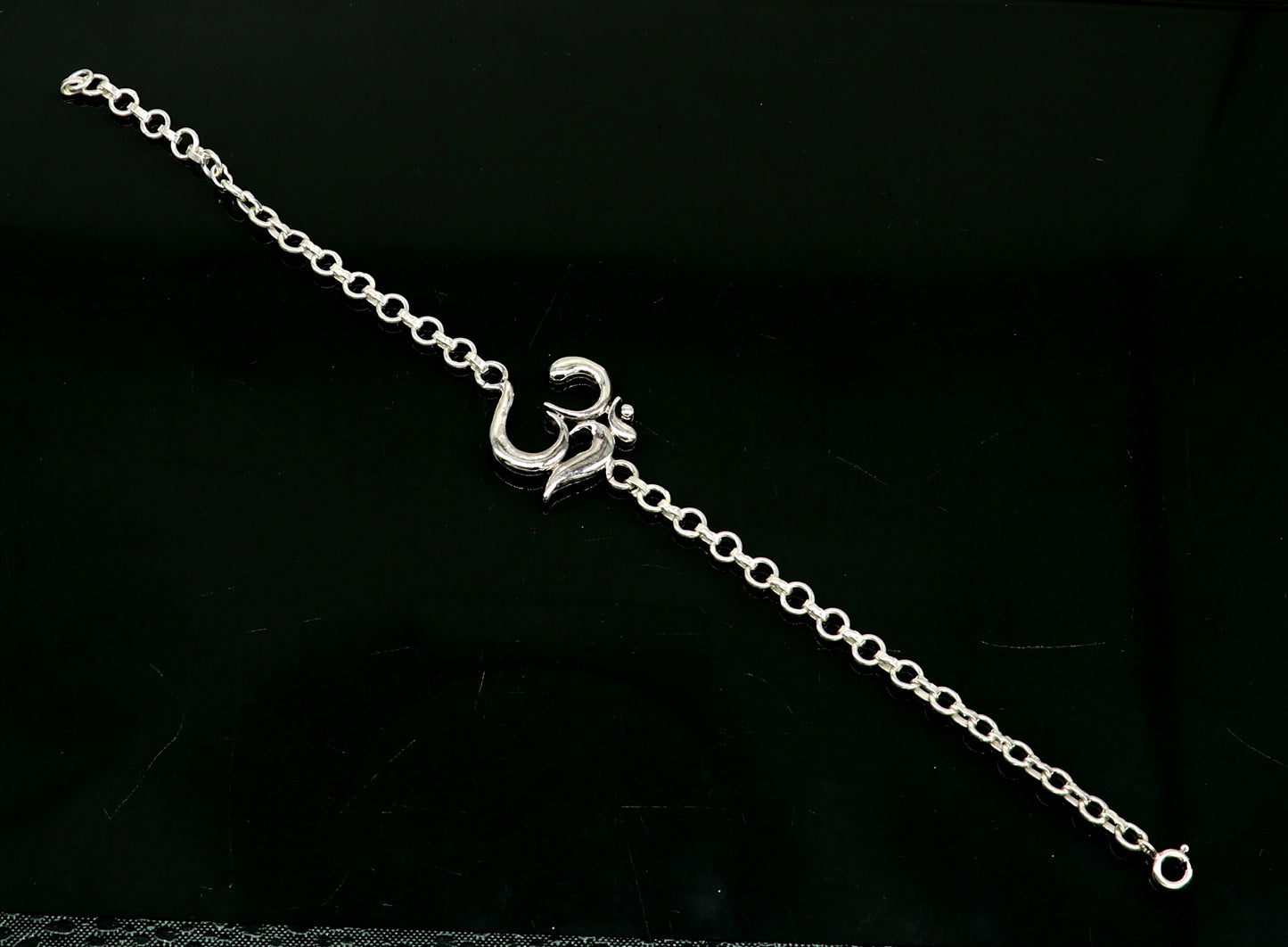 Sterling silver OM mantra bracelet by TRIBAL ORNAMENTS, handmade 7-inch bracelet with intricate Aum design in all sizes.