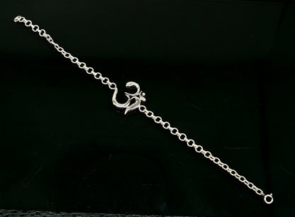 Sterling silver OM mantra bracelet by TRIBAL ORNAMENTS, handmade 7-inch bracelet with intricate Aum design in all sizes.