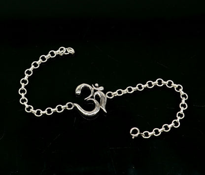 Sterling silver OM mantra bracelet by Tribal Ornaments, handmade 7-inch bracelet with intricate Aum design, available in all sizes.