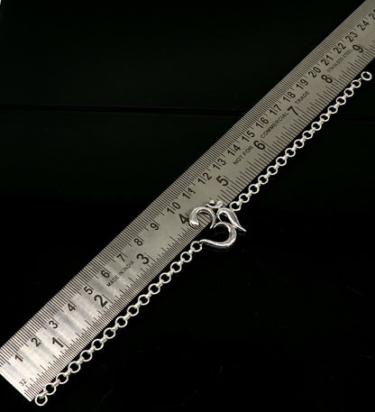 Sterling silver OM mantra bracelet by TRIBAL ORNAMENTS, handmade 7-inch bracelet with intricate Aum design.