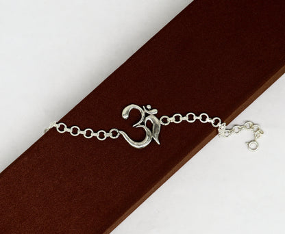 Sterling silver OM mantra bracelet by TRIBAL ORNAMENTS, handmade 7-inch design with intricate Aum OM symbols, all sizes available.