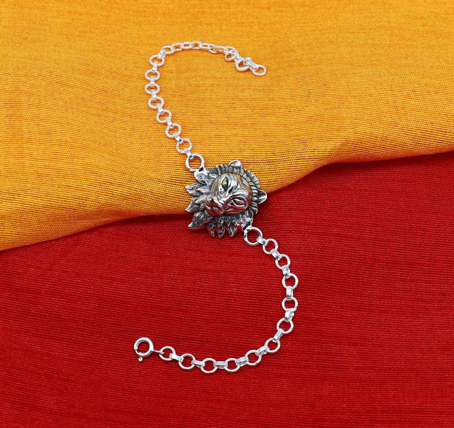 Sterling silver Narsimha lion face bracelet by TRIBAL ORNAMENTS, handmade with intricate design, available in all sizes.