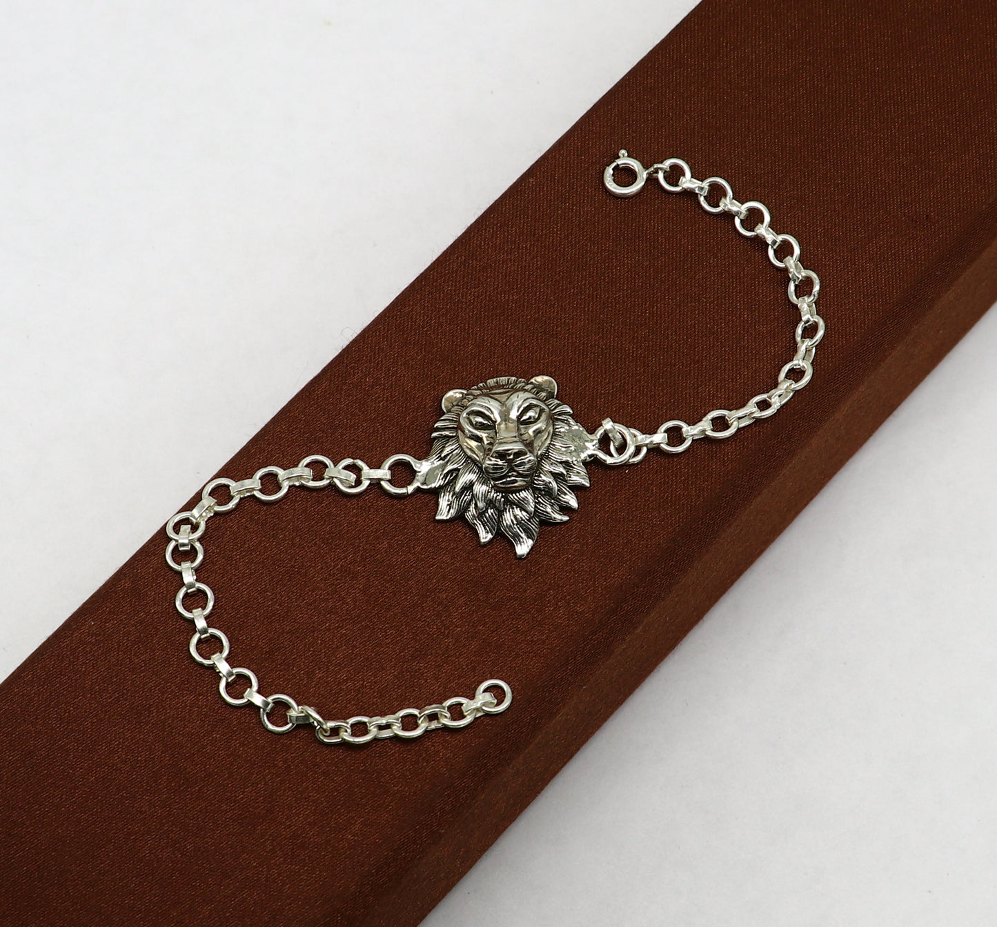 Sterling silver Narsimha lion face bracelet by TRIBAL ORNAMENTS, 7-inch handmade bracelet with intricate tribal design.