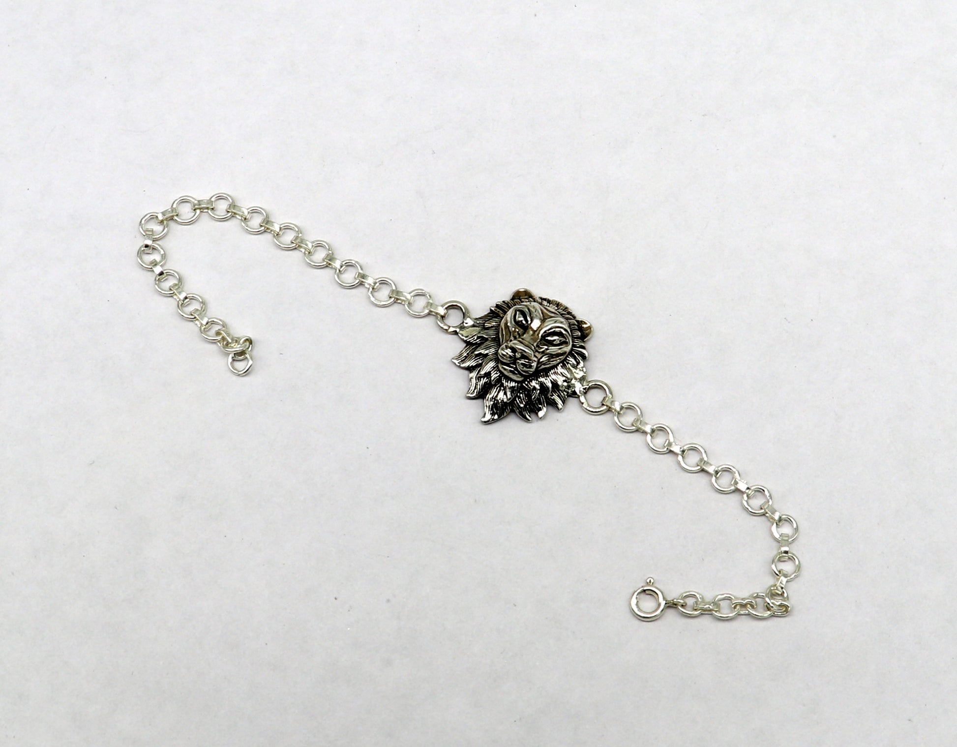 Sterling silver Narsimha lion face bracelet by Tribal Ornaments, handmade with detailed lion design in all sizes.
