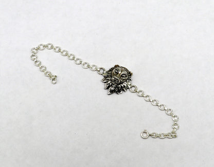 Sterling silver Narsimha lion face bracelet by Tribal Ornaments, handmade with detailed lion design in all sizes.