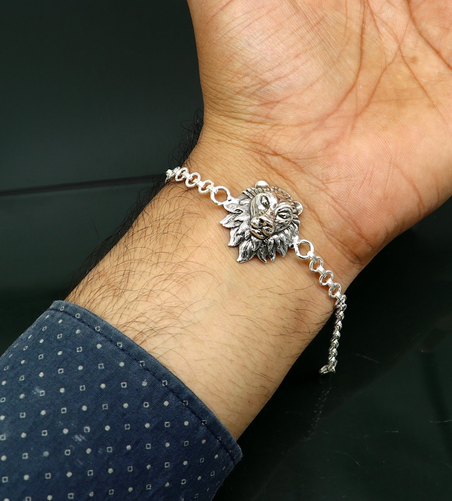 Sterling silver Narsimha lion face bracelet by TRIBAL ORNAMENTS, handmade with intricate design, available in all sizes.