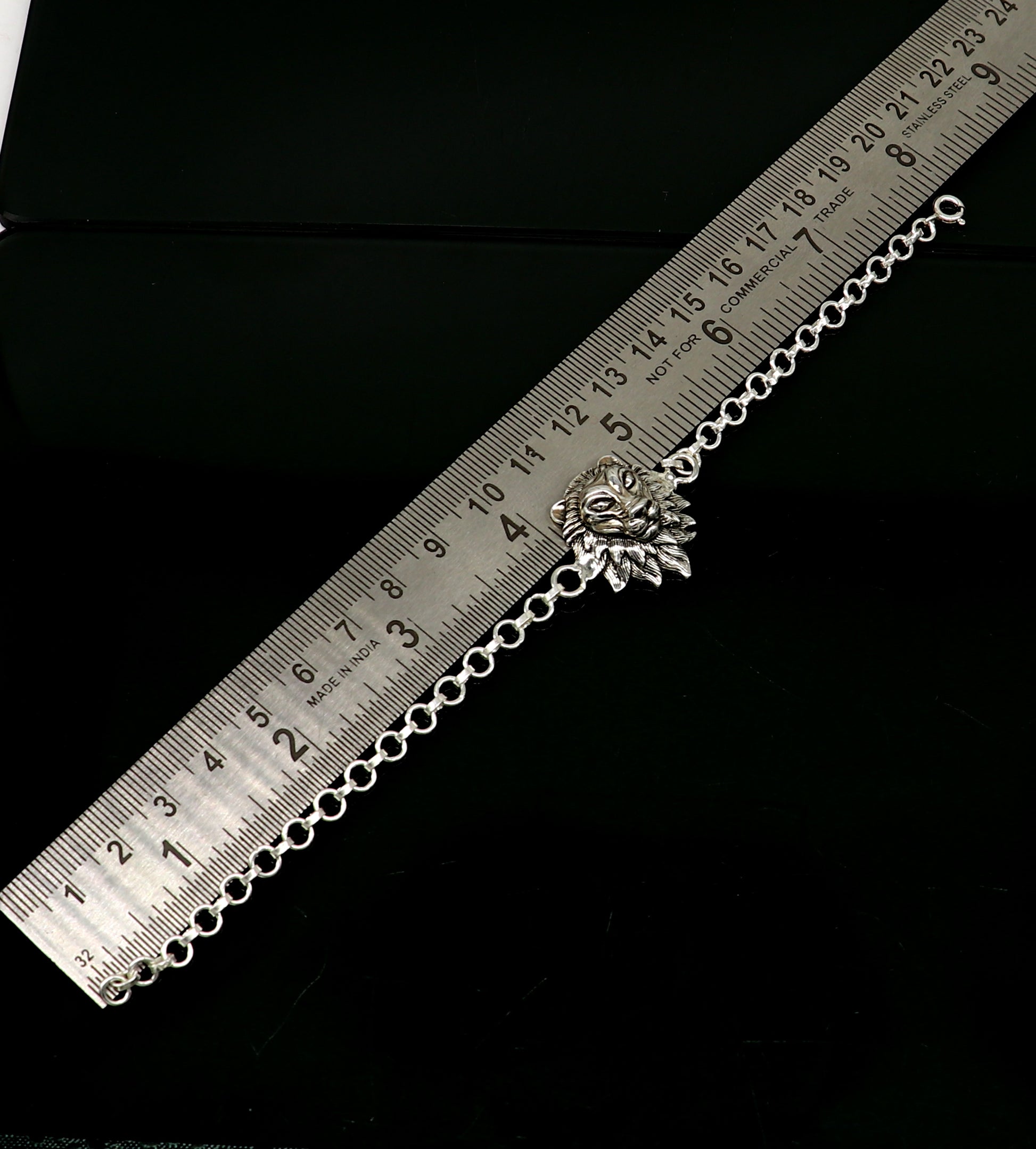 Sterling silver Narsimha lion face bracelet by TRIBAL ORNAMENTS, handmade 7-inch bracelet with detailed lion design in all sizes.