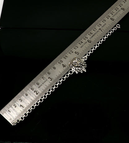 Sterling silver Narsimha lion face bracelet by TRIBAL ORNAMENTS, handmade 7-inch bracelet with detailed lion design in all sizes.