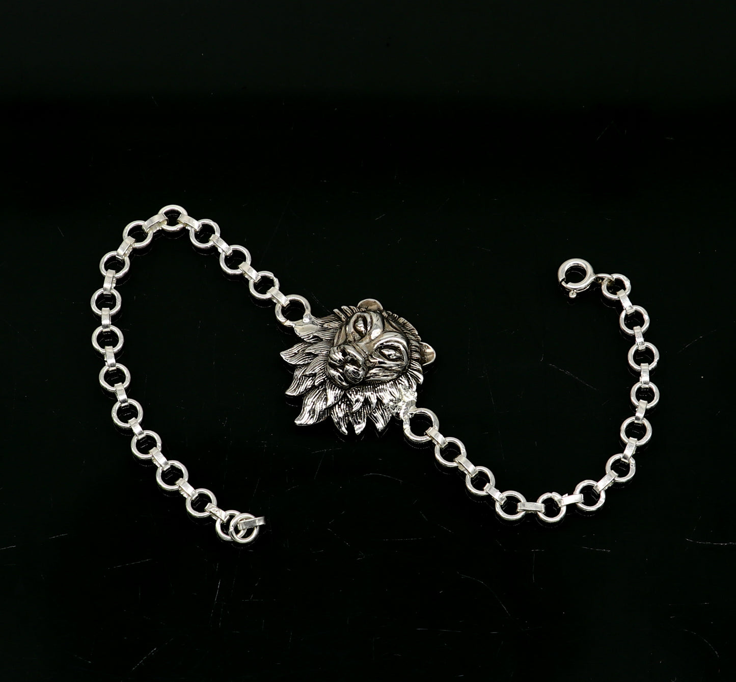 Sterling silver Narsimha lion face bracelet by TRIBAL ORNAMENTS, 7-inch handmade bracelet with intricate tribal design.
