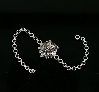 Sterling silver Narsimha lion face bracelet by TRIBAL ORNAMENTS, 7-inch handmade bracelet with intricate tribal design.
