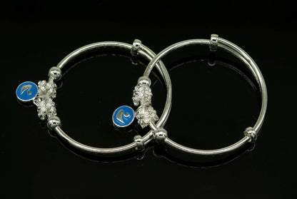 Unisex 925 sterling silver adjustable charm bangle bracelet with tribal design, suitable for kids and babies.