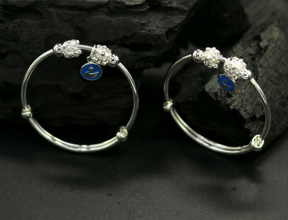 Unisex 925 sterling silver adjustable charm bangle bracelet with tribal designs for kids and babies, by TRIBAL ORNAMENTS.