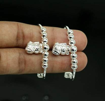 Unisex adjustable 925 sterling silver charm bangle bracelet with tribal design, suitable for kids and babies by Tribal Ornaments.