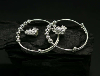 Unisex 925 sterling silver adjustable charm bangle bracelet with intricate tribal design, suitable for kids and babies.