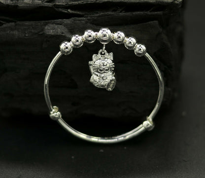 Unisex 925 sterling silver adjustable charm bangle bracelet with tribal ornament design, suitable for kids and babies.