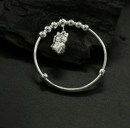Unisex 925 sterling silver adjustable charm bangle bracelet with tribal ornament design for kids and babies.