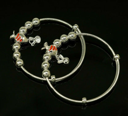 Unisex 925 sterling silver adjustable charm bangle bracelet with intricate tribal designs for kids and babies.
