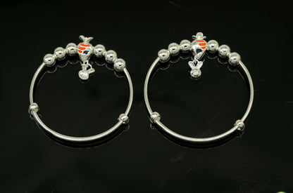 Sterling silver adjustable charm bangle bracelet by Tribal Ornaments, unisex design suitable for kids and babies.