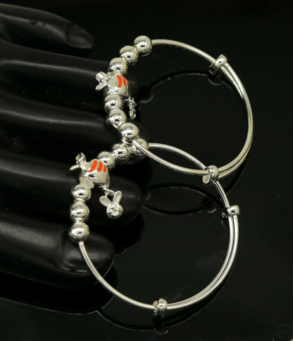Unisex 925 sterling silver adjustable charm bangle bracelet with tribal-inspired design for kids and babies.