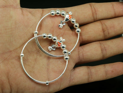 Sterling silver adjustable charm bangle bracelet from Tribal Ornaments, unisex design suitable for kids and babies.