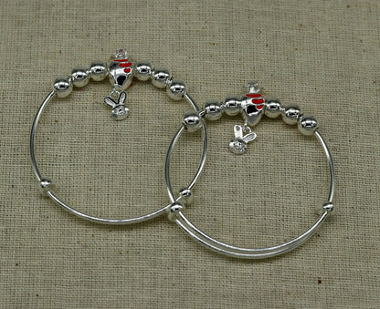 Sterling silver adjustable charm bangle bracelet with tribal design, suitable for kids, babies, and unisex wear by Tribal Ornaments.