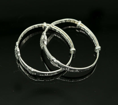 Sterling silver adjustable charm bangle bracelet by Tribal Ornaments, unisex kids and baby jewelry with intricate design.