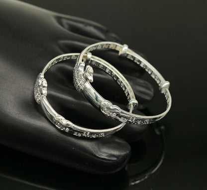 Sterling silver adjustable charm bangle bracelet by Tribal Ornaments, unisex kids and baby jewelry with intricate design.