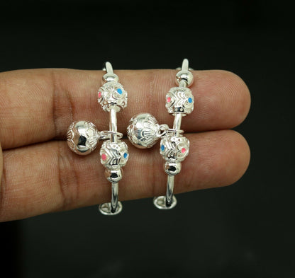 Unisex 925 sterling silver adjustable charm bangle bracelet with intricate tribal design, suitable for kids and babies.