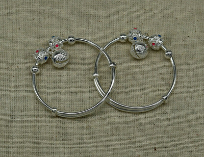 Unisex 925 sterling silver adjustable charm bangle bracelet with intricate tribal ornament design for kids and babies.