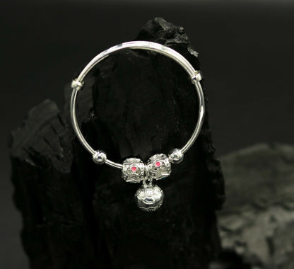 Unisex 925 sterling silver adjustable charm bangle bracelet with intricate tribal design, suitable for kids and babies.