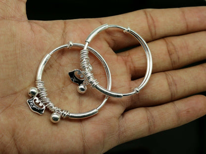 Unisex 925 sterling silver adjustable charm bangle bracelet with intricate tribal designs for kids and babies.