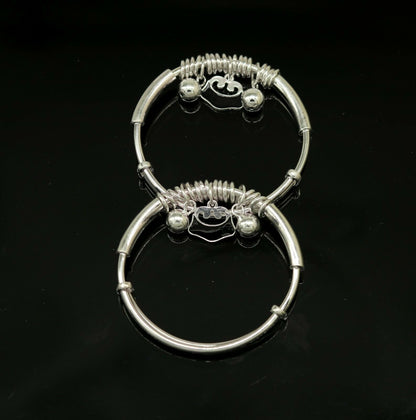 Sterling silver adjustable charm bangle bracelet with tribal design for kids and unisex, featuring intricate details.