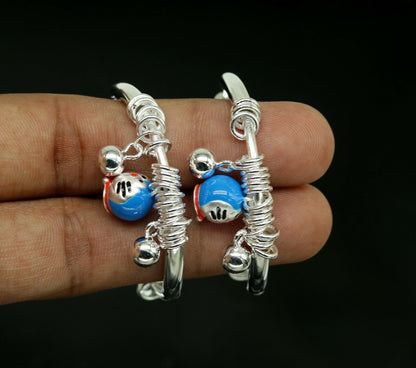 Sterling silver adjustable charm bangle bracelet by Tribal Ornaments, unisex kids and baby jewelry, featuring intricate design.