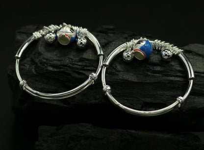 Unisex 925 sterling silver adjustable charm bangle bracelet with intricate tribal design for kids and babies.