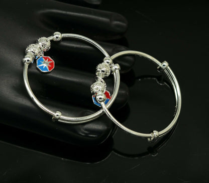 Unisex 925 sterling silver adjustable charm bangle bracelet with intricate tribal design, suitable for kids and babies.
